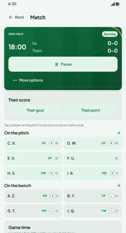 The match clock with players listed on the pitch and on the bench.